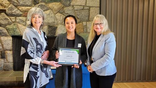 Katlea Go presented with the Service Award certificate for completion of 10 years of service at Fraserside
