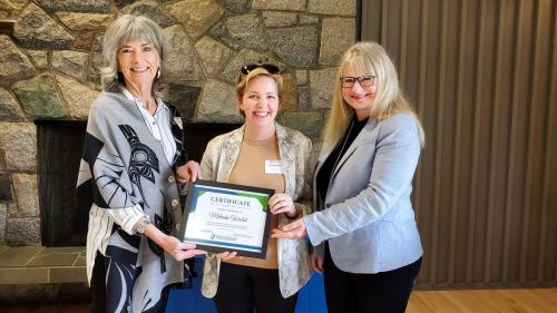 Melinda Walsh presented with the Service Award certificate for completion of 10 years of service at Fraserside