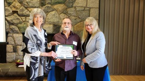 Patrick Tyler presented with the Service Award certificate for completion of 15 years of service at Fraserside