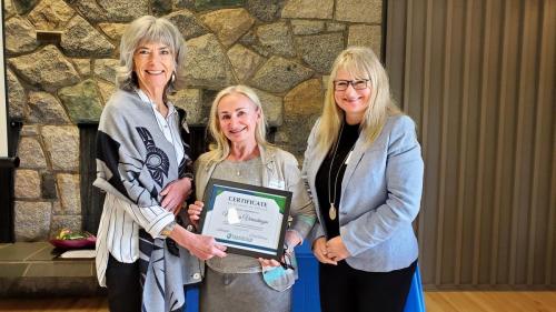 Marina Vereschagin presented with the Service Award certificate for completion of 25 years of service at Fraserside