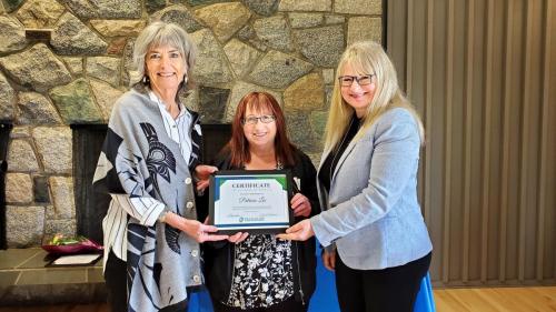 Patricia (Trish) Lee presented with the Service Award certificate for completion of 25 years of service at Fraserside