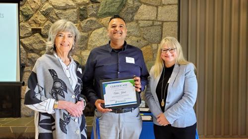Avtar Johal presented with the Service Award certificate for completion of 5 years of service at Fraserside