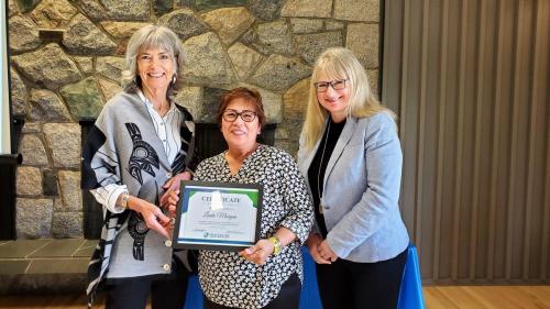 Linda Morgan presented with the Service Award certificate for completion of 5 years of service at Fraserside