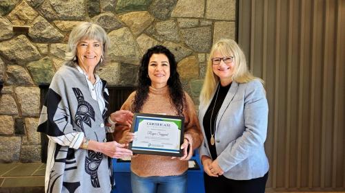 Roya Sayyad presented with the Service Award certificate for completion of 5 years of service at Fraserside